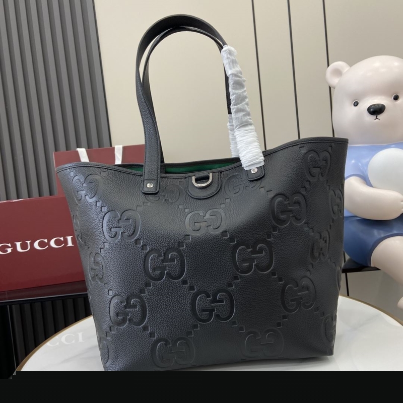 G*u*i shopping bags